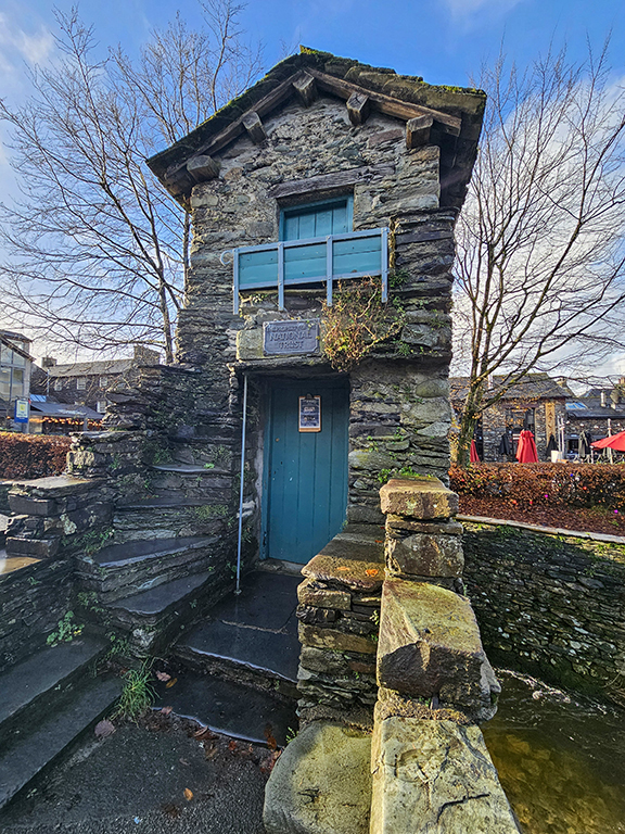 Bridge House, Ambleside.  The front door, and steps up to the upper storey.