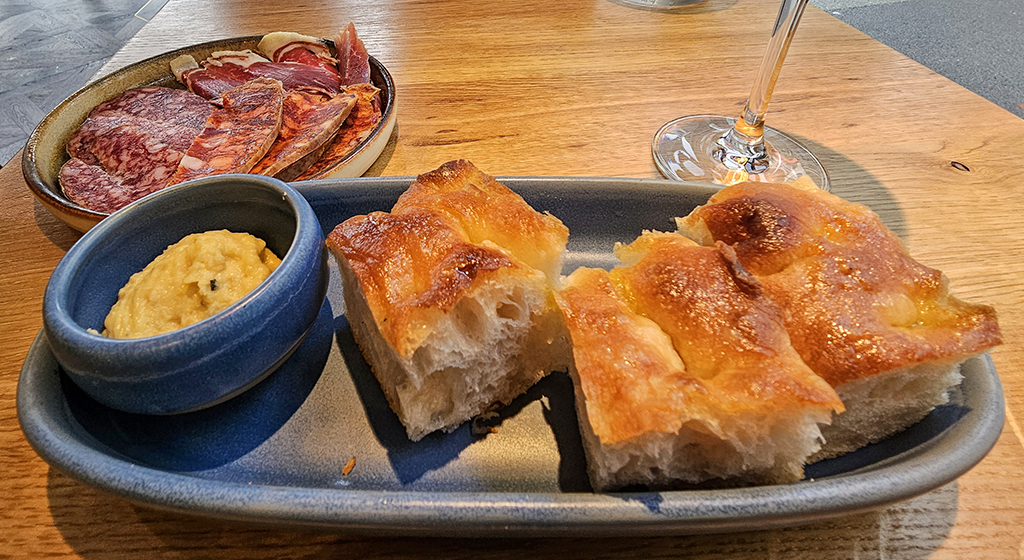The Schelly. Trio of cured bellota de Iberico and focaccia with roasted garlic and rosemary hummus.