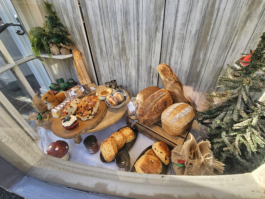 A selection of breads and pastries in the window of one of the bakeries in Ambleside