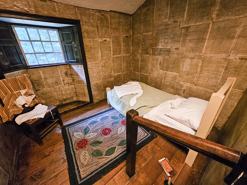 Dove Cottage bedroom with newspaper as wallpaper