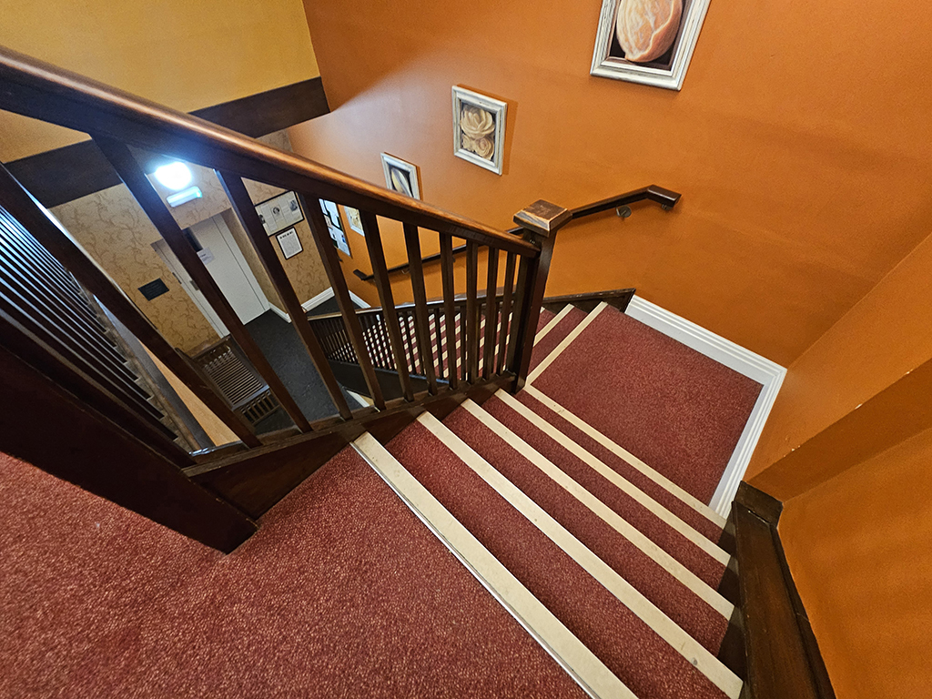 Royal Oak, Keswick. Stairs to the first floor flat.  The lift is out of order and has been for some time.